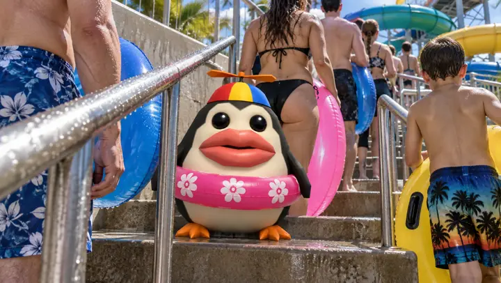 Pengoof waiting in a real queue of people